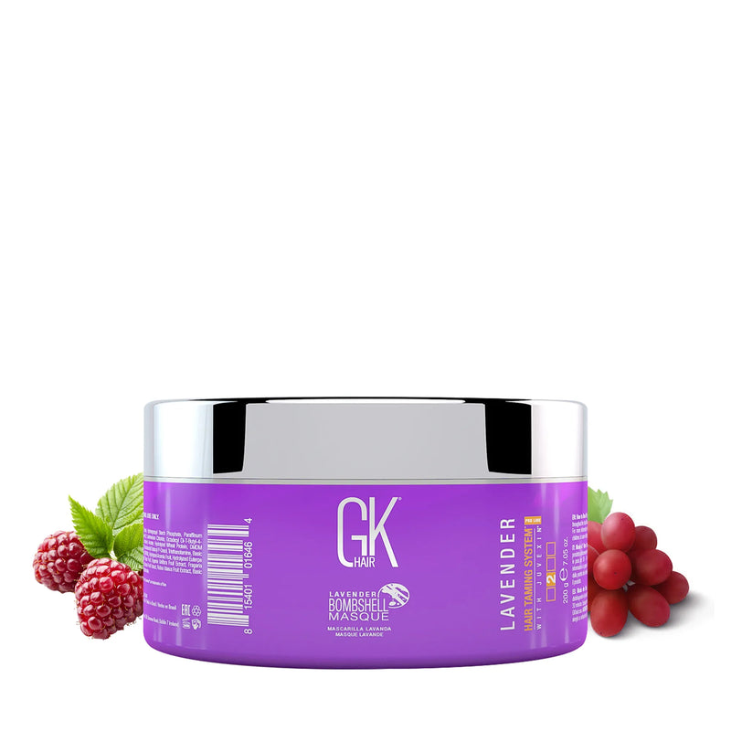 GK Hair Lavender Bombshell Masque, purple 200 g jar with a chrome lid turned to its label, raspberries and red grapes beside it