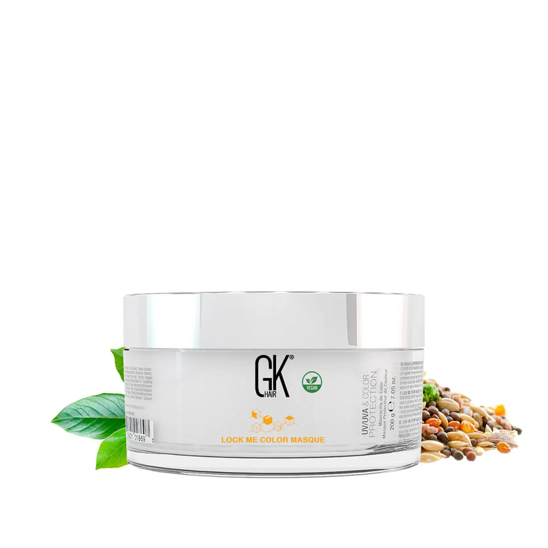 GK Hair Lock Me Color Masque 200 g clear tub, white lid, vegan badge, UV/UVA & Color Protection text, among leaves and seeds