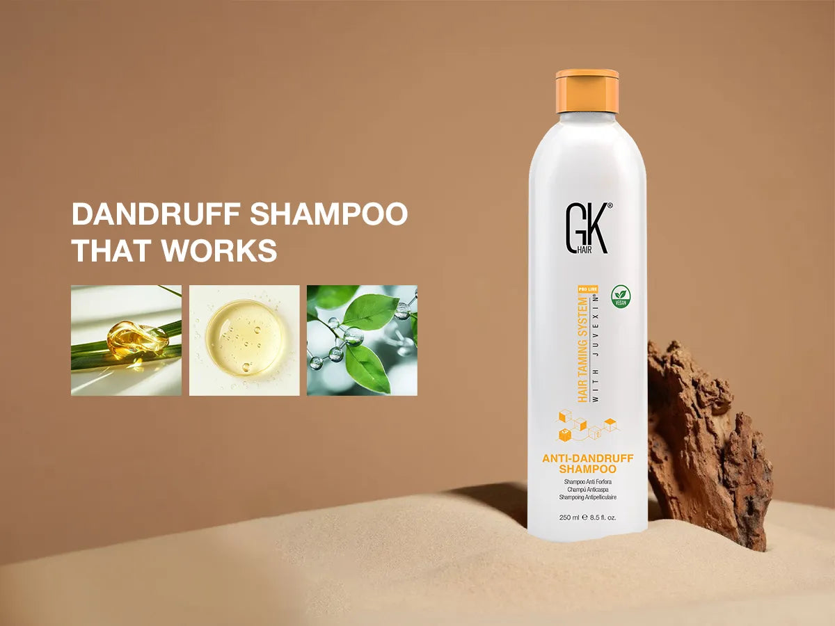 GK Hair Anti-Dandruff Shampoo standing on sand beside a rock, with ingredient close-up images and the text ‘Dandruff Shampoo That Works’ displayed on a beige background.