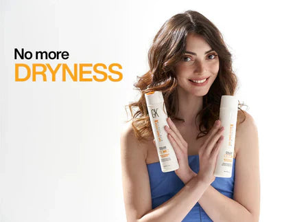 A Lady Holding Two Hair Product