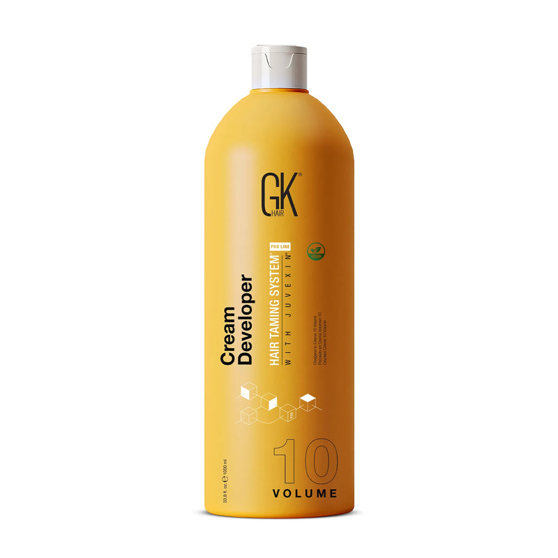 GK Hair Cream Developer 10 Volume, tall 1000 ml yellow bottle with a white cap and green vegan badge, on white