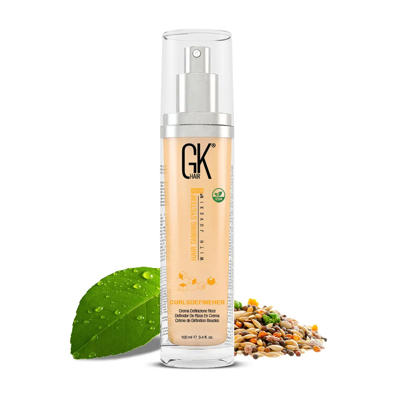 GK Hair CurlsDefineHer curl defining cream 100 ml pump bottle with vegan badge, dewy green leaf at left, mixed seeds at right