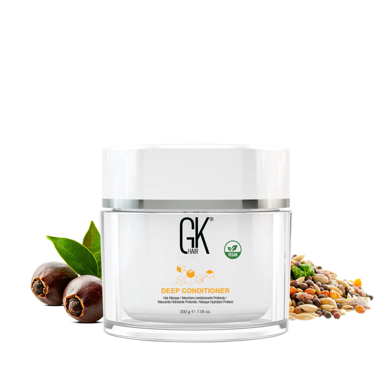 GK Hair Deep Conditioner 200 g jar with vegan icon centered on white, flanked by soapnuts, green leaves and mixed seeds