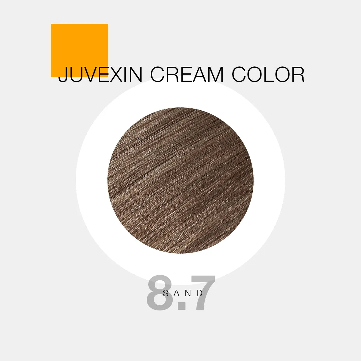A circular swatch of Juvexin Cream Color in shade 8.7 "Sand," showcasing a soft, warm brown tone against a light gray background.