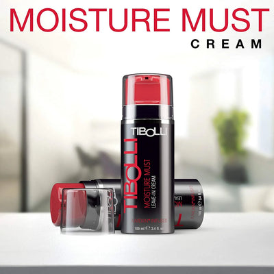 Tibolli Moisture Must Leave-In Cream with red accents, placed on a table, highlighted by a blurred background.
