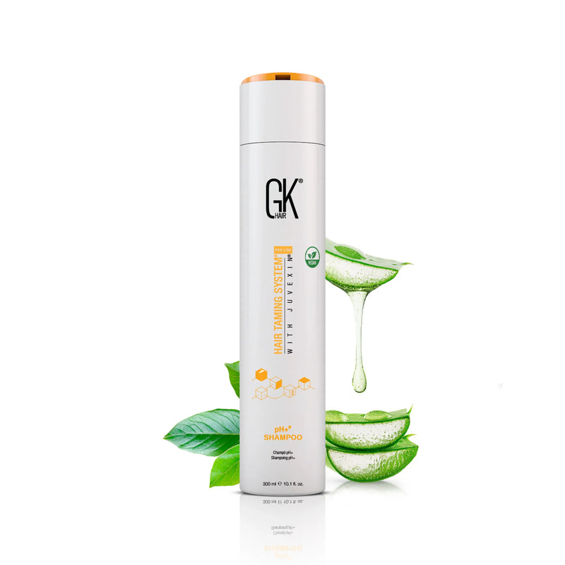 GK Hair pH+ Shampoo 300 ml white bottle with an orange cap, sliced aloe vera leaves and gel dripping beside it